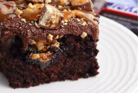 Decadent Snickers Poke Cake: Gooey Chocolate-Caramel Dessert