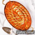 Classic French Ratatouille Recipe: Rustic Vegetable Stew Tutorial 17 Top down of a baked ratatouille in an oval pan.