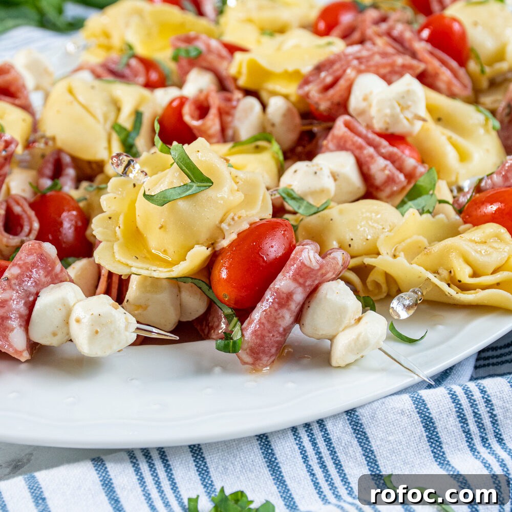 Slow-Cooker Christmas Wassail Recipe for Festive Parties 10 Tortellini skewers on a platter.