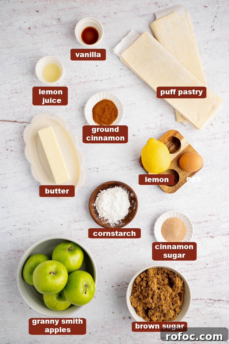 Homemade Apple Hand Pies: Flaky Mini Pastry Recipe 2 All of the ingredients for apple hand pies in bowls on a white countertop.
