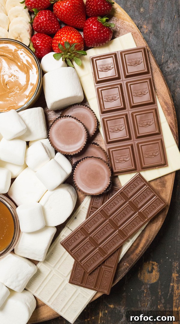 S'mores Party Board Ideas for Gatherings and Dessert Nights 4 Various chocolate bars and candies on a s'mores board.