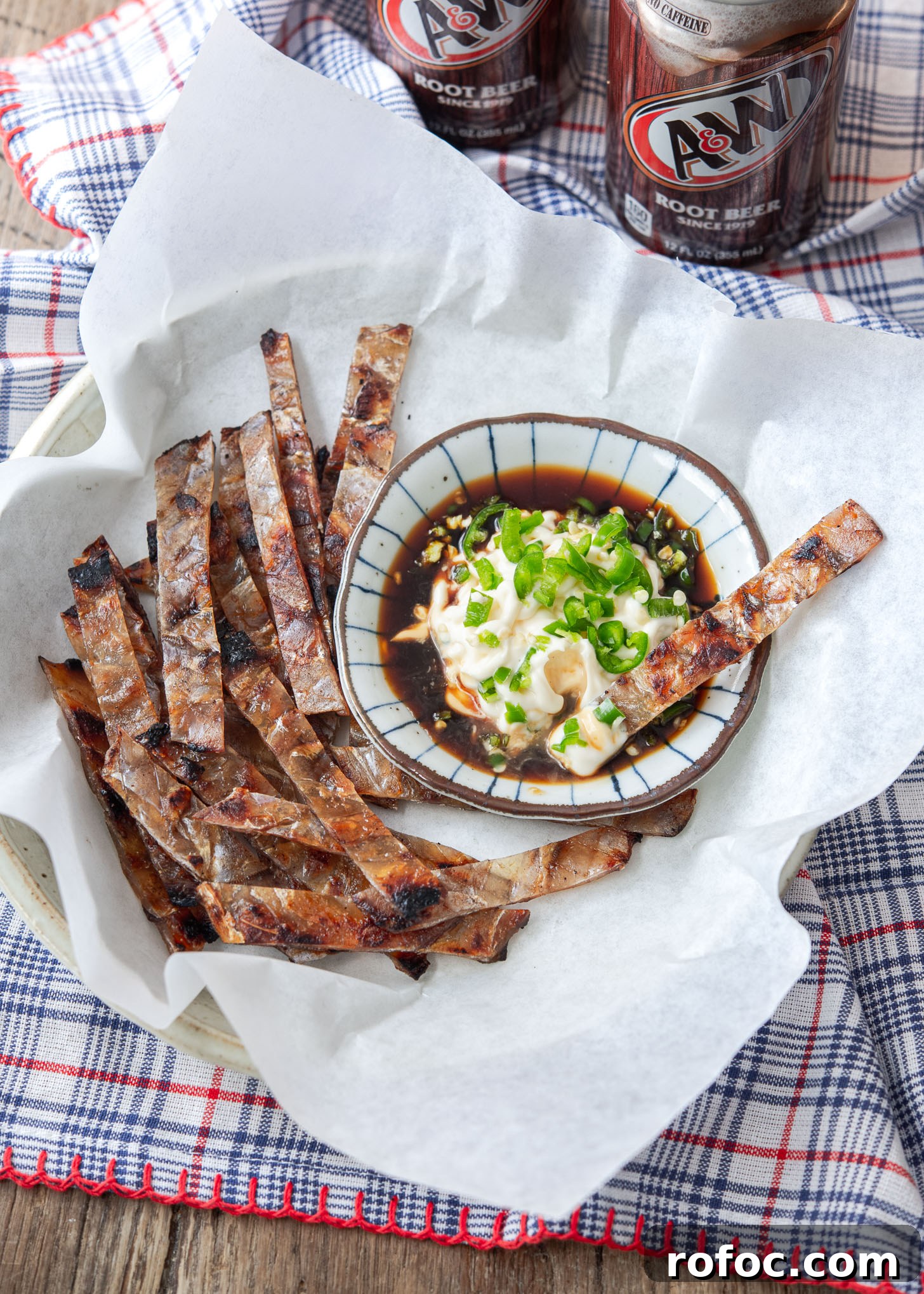 Korean-Style Jwipo Fish Jerky: Spicy Dried Fish Snack Guide 4 Strips of jwipo is served with soy mayo chili dipping sauce on the side.