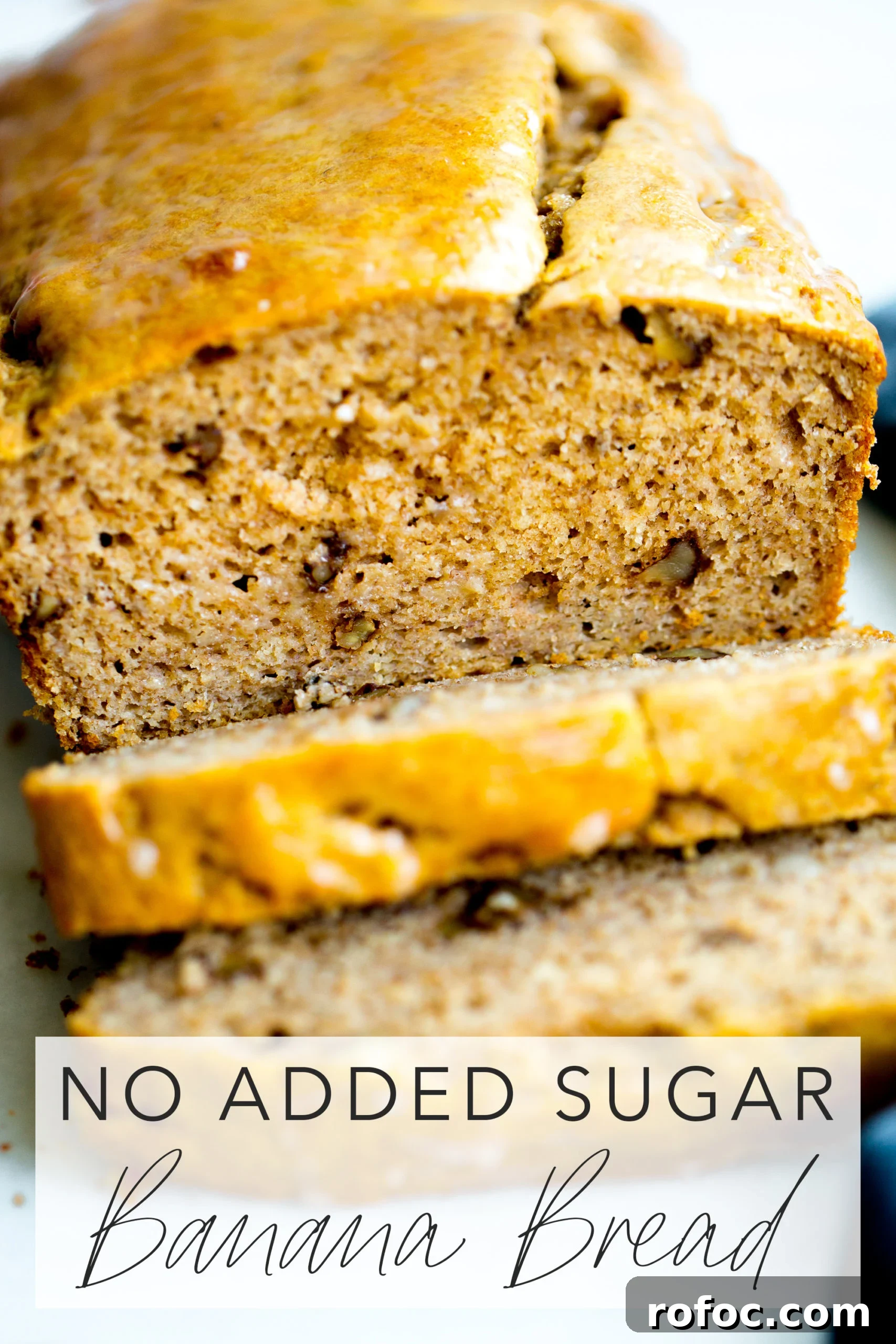 close up photo of a loaf of healthy banana bread with walnuts with title text overlay