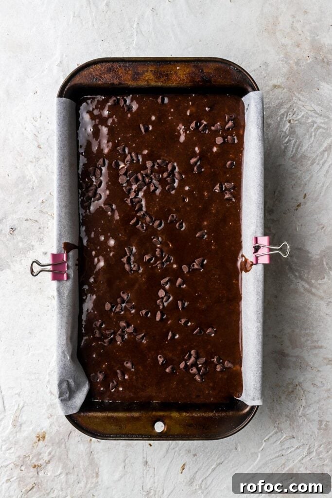 Decadent Chocolate Banana Bread Recipe with Melted Chips 9 chocolate banana bread batter in the loaf pan