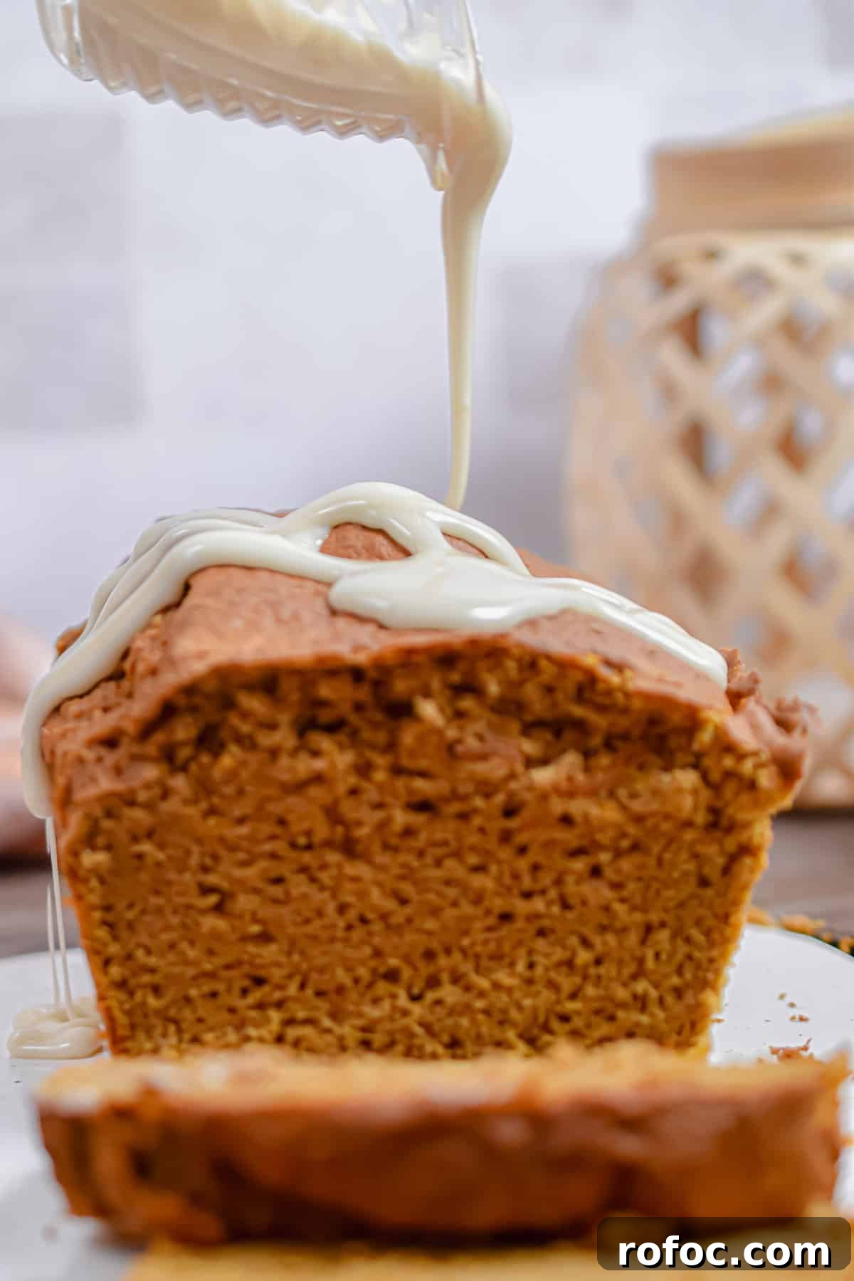 Moist Pumpkin Bread Made with Cake Mix in 1 Bowl 4 The icing is drizzled over the pumpkin bread.