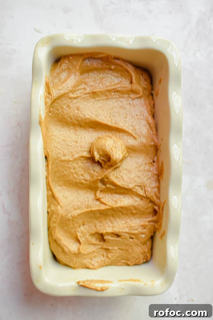 Moist Pumpkin Bread Made with Cake Mix in 1 Bowl 6 The batter is poured into a prepared loaf pan.