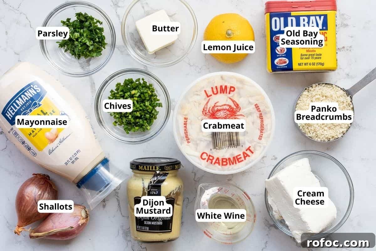 Creamy Baked Crab Dip with Garlic and Parmesan 3 ingredients for crab dip: crabmeat, mayo, old bay seasoning, panko breadcrumbs, cream cheese, shallots, parsley, chives, butter, lemon juice, white wine, and dijon mustard.