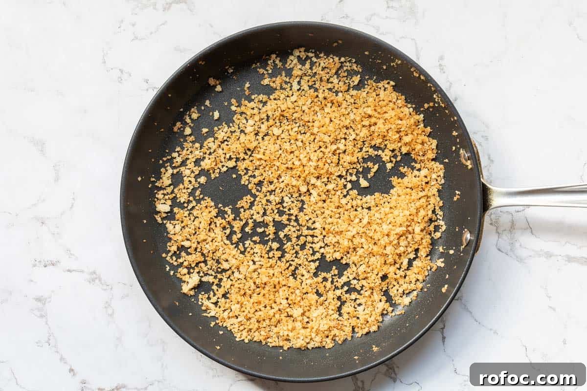 Creamy Baked Crab Dip with Garlic and Parmesan 6 toasted breadcrumbs in large skillet.