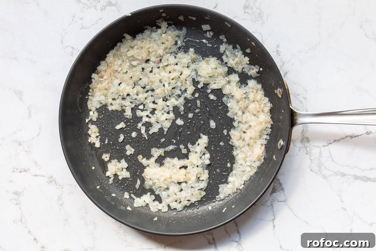 Creamy Baked Crab Dip with Garlic and Parmesan 7 sauteed shallots in butter in large skillet.