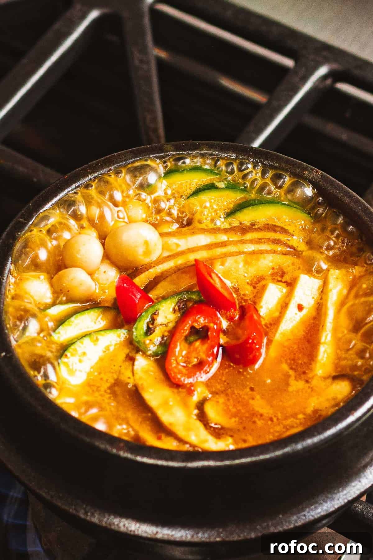 Authentic Doenjang Jjigae Recipe: Korean Soybean Paste Stew Guide 2 Doenjang jjigae bubbling in an earthenware pot.