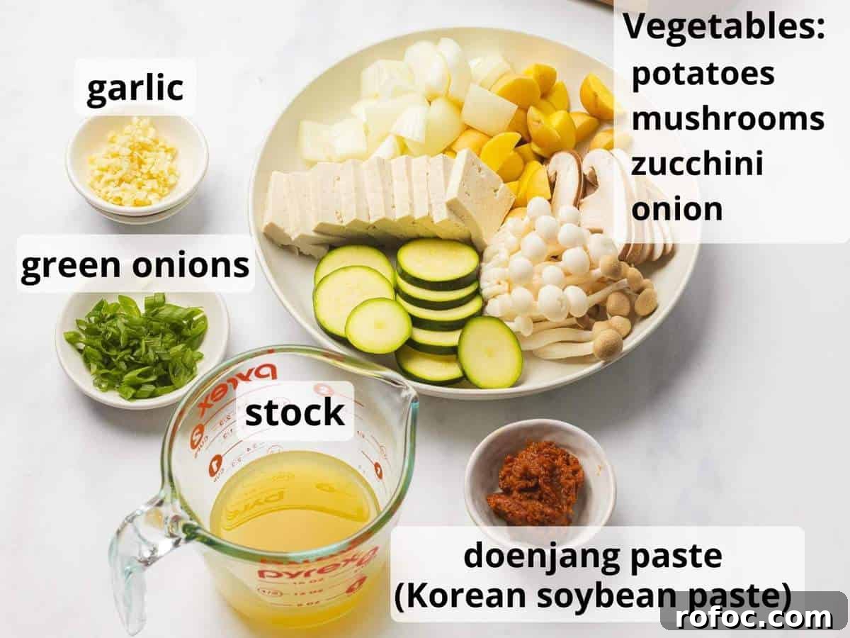 Authentic Doenjang Jjigae Recipe: Korean Soybean Paste Stew Guide 4 Ingredients for doenjang jjigae with text.