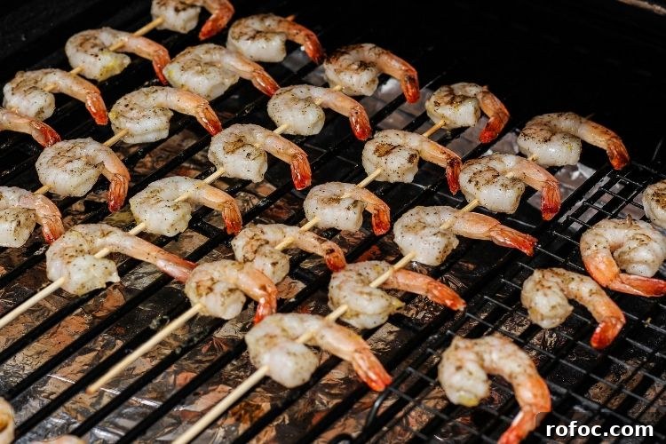 Perfect Grilled Shrimp: Quick Charred Shrimp Recipe for Summer 4 shrimp skewers on a grill