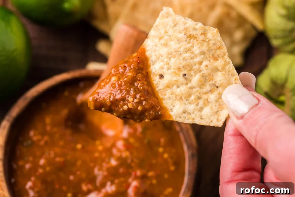 50 Quick Dinner Ideas to Make When You Don't Feel Like Cooking 8 Homemade red salsa in a bowl with a tortilla chip in it.