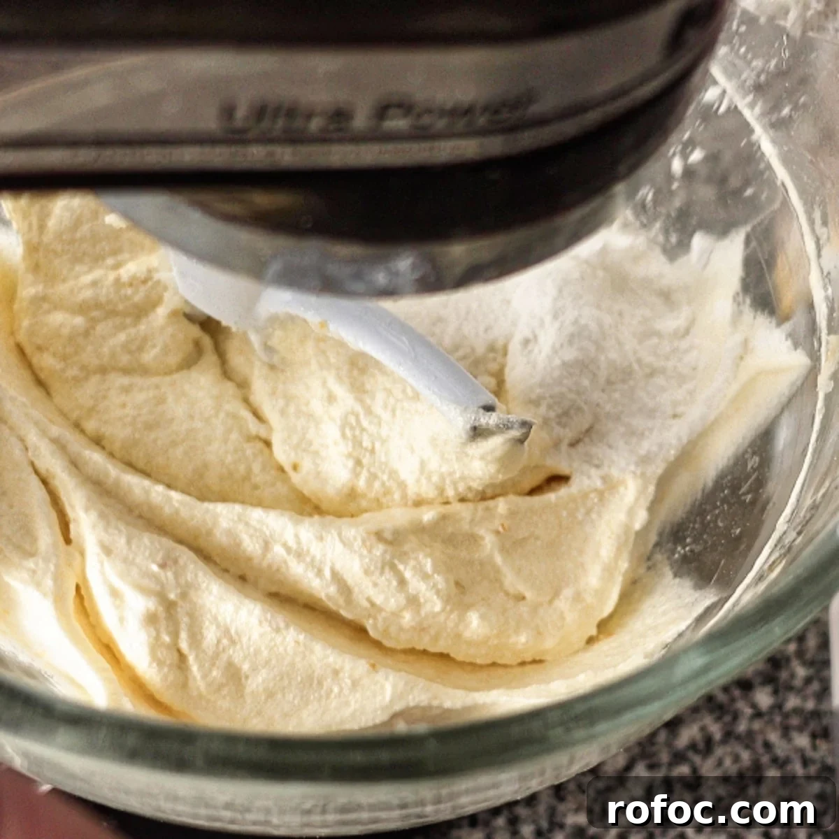 Gluten-Free Lemon Loaf: Starbucks Copycat Recipe for Moist Zest 9 adding flour to batter in glass mixing bowl.