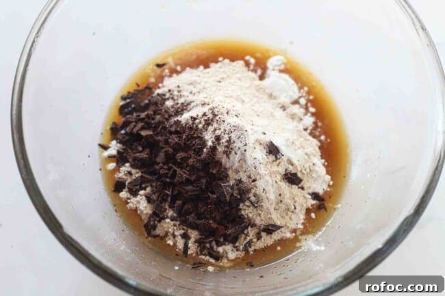 Ultimate Chewy Chocolate Chip Cookies Made with Melted Butter 5 Mixing cookie dough in a bowl.