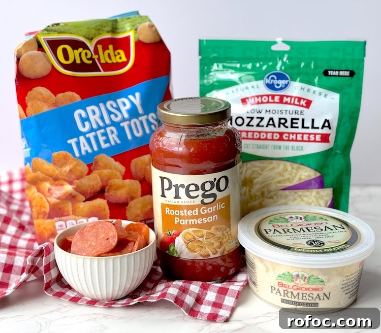 Tater Tot Pizza Casserole Recipe for Family Weeknight Meals 4 Ingredients for an easy pizza tater tot casserole including frozen tater tots, pepperoni, mozzarella cheese, parmesan, and pasta sauce.