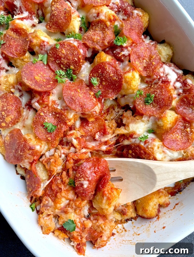Tater Tot Pizza Casserole Recipe for Family Weeknight Meals 8 Easy no prep dump dinner made with frozen tater tots and pepperoni, to make a unique pizza in the form of a casserole.