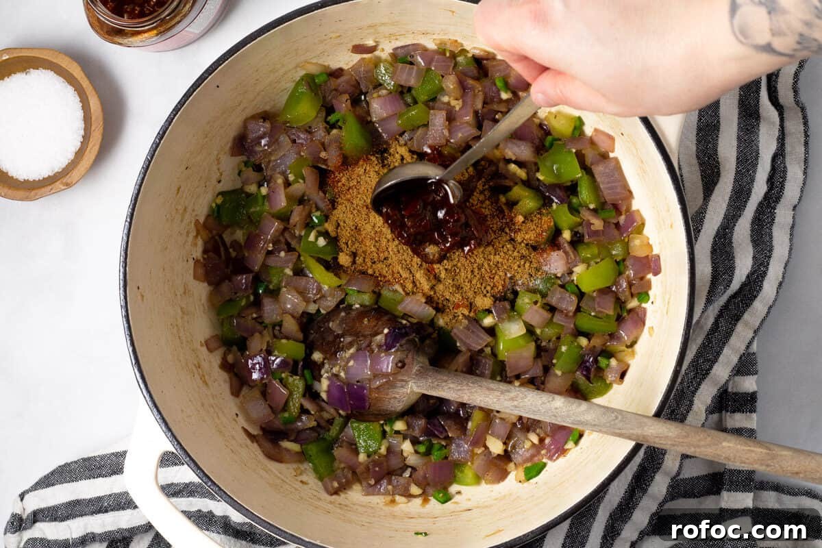 Large white pot filled with ingredients to make short rib chili