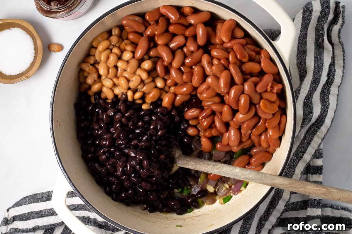 Large white pot filled with ingredients to make short rib chili