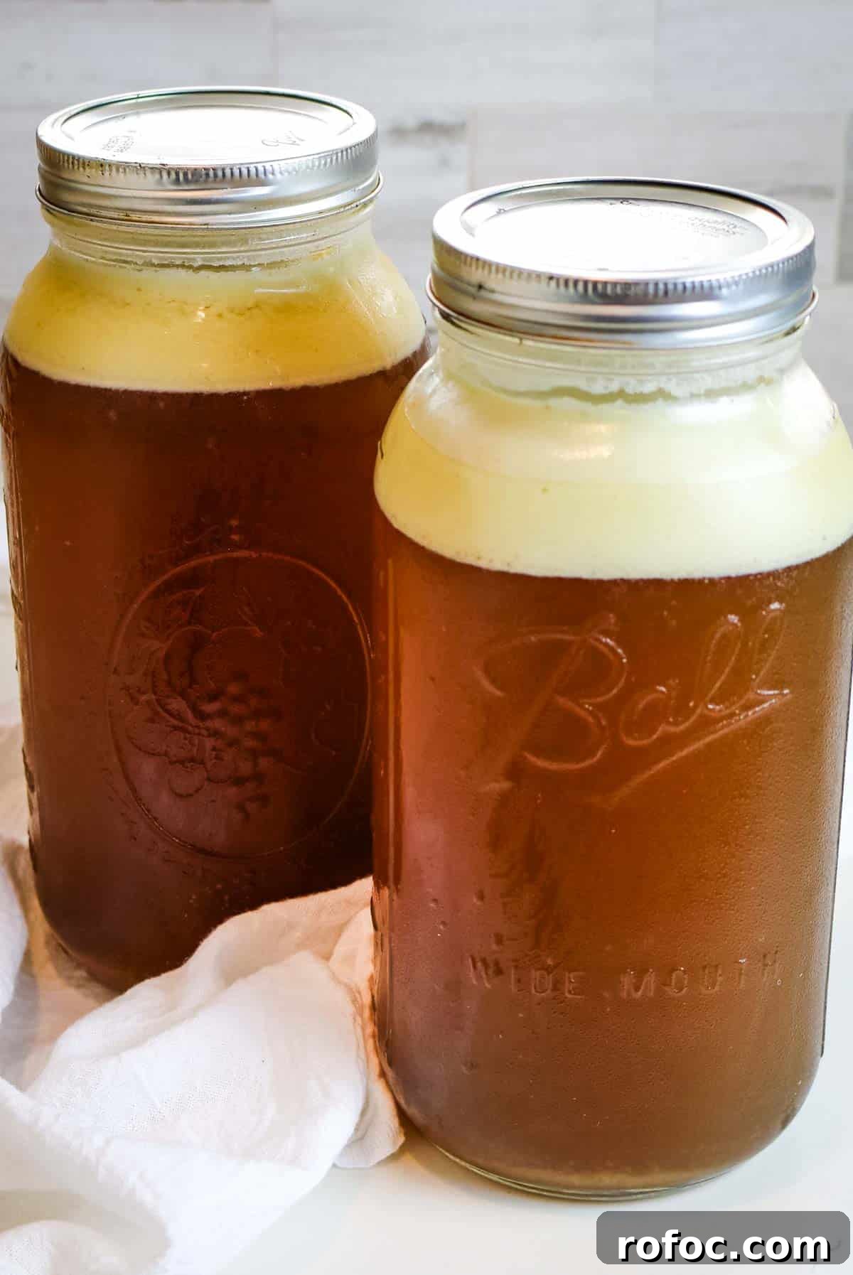 Rich Homemade Beef Bone Broth Recipe for Deep Flavor and Nutrition 15 chilled broth in mason jars.
