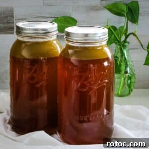 Rich Homemade Beef Bone Broth Recipe for Deep Flavor and Nutrition 16 beef bone broth in mason jars.
