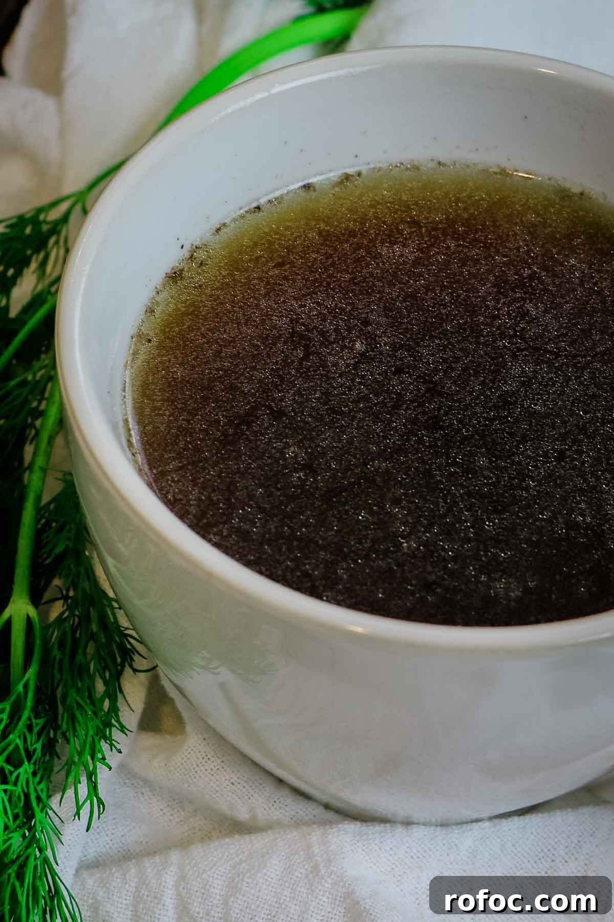 Rich Homemade Beef Bone Broth Recipe for Deep Flavor and Nutrition 3 bone broth in white mug