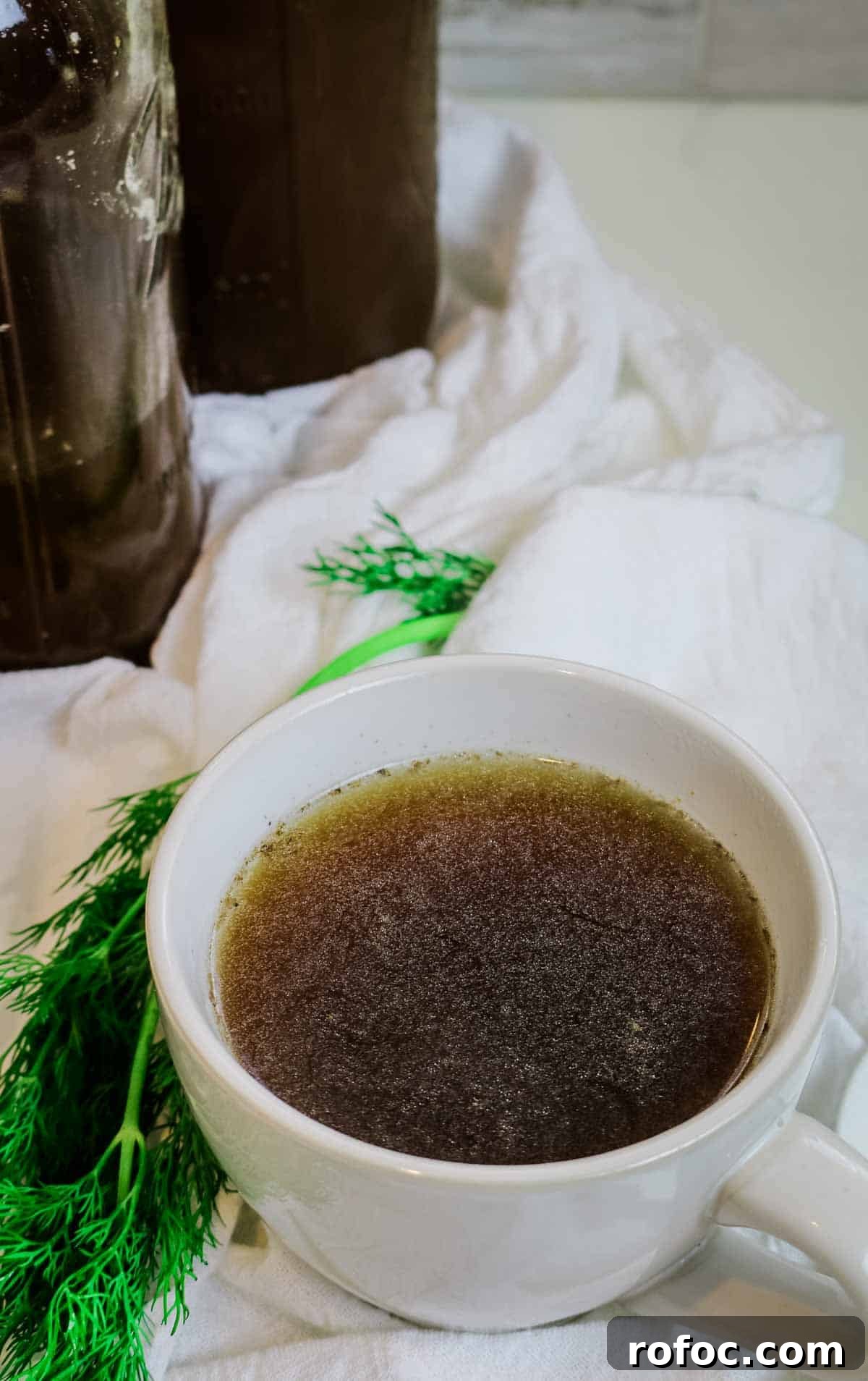Rich Homemade Beef Bone Broth Recipe for Deep Flavor and Nutrition 5 beef bone broth in a mug.