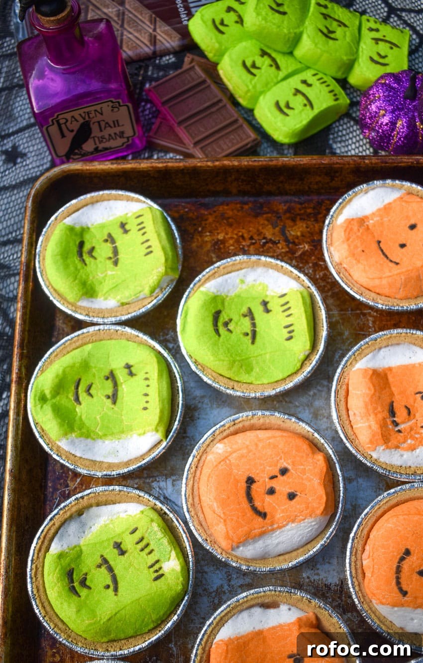 Halloween Peeps Mini S'mores Pies: Spooky No-Bake Treats 2 halloween peeps mini s'mores pies on a metal baking sheet