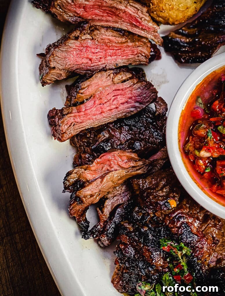 skirt steak sliced on a platter cooked to medium rare