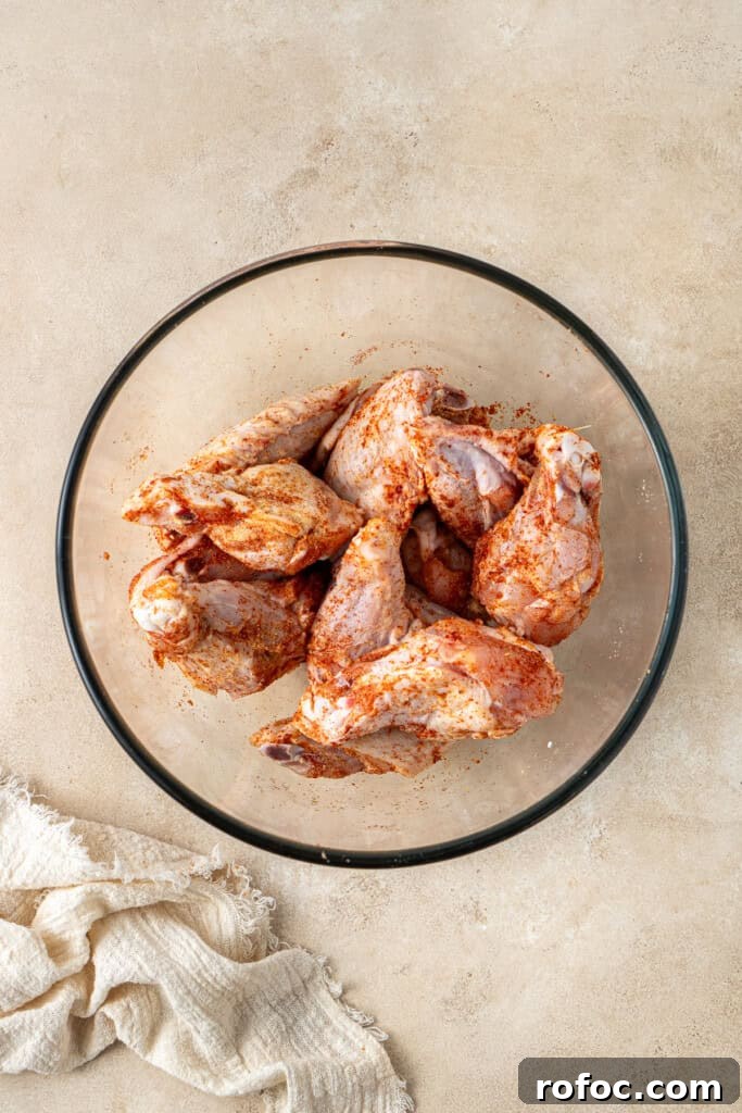 Spicy Honey-Glazed Chicken Wings Recipe for Game Day 5 The cut chicken wings in a bowl.