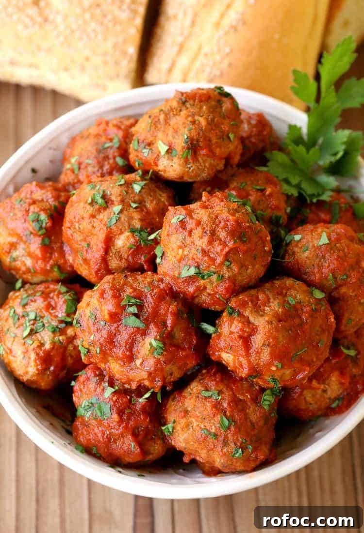 Sunday-Style Grandma’s Meatballs with Savory Tomato Sauce 3 Grandma's Sunday Meatballs and Sauce on a board from the top