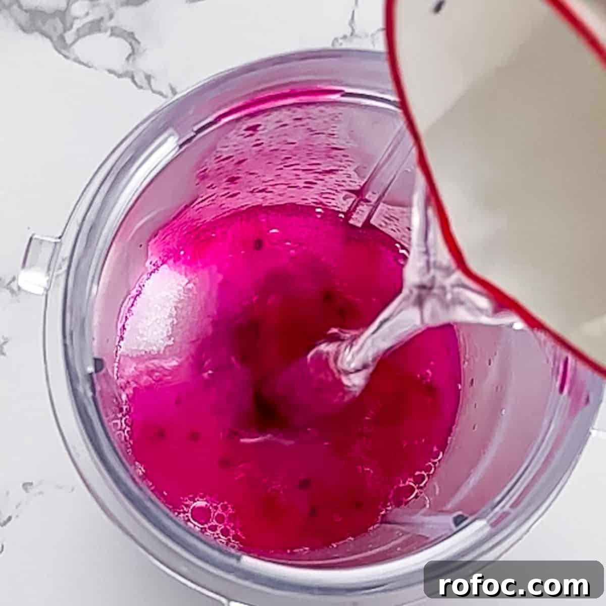 Starbucks Dragon Drink Guide: Ingredients, Nutrition & How to Order 4 Adding water, sugar, and dragonfruit to a high speed blender.