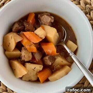Traditional Irish Beef Stew Recipe for Hearty Weeknight Dinners 19 Irish stew in a small bowl with a spoon.