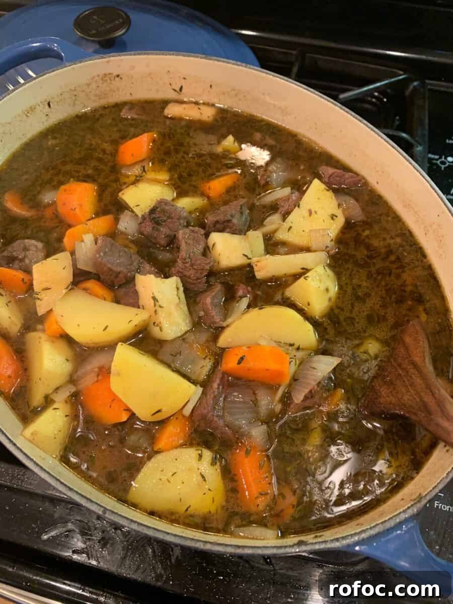 Traditional Irish Beef Stew Recipe for Hearty Weeknight Dinners 7 St. Patrick's Day stew cooking on the stove.