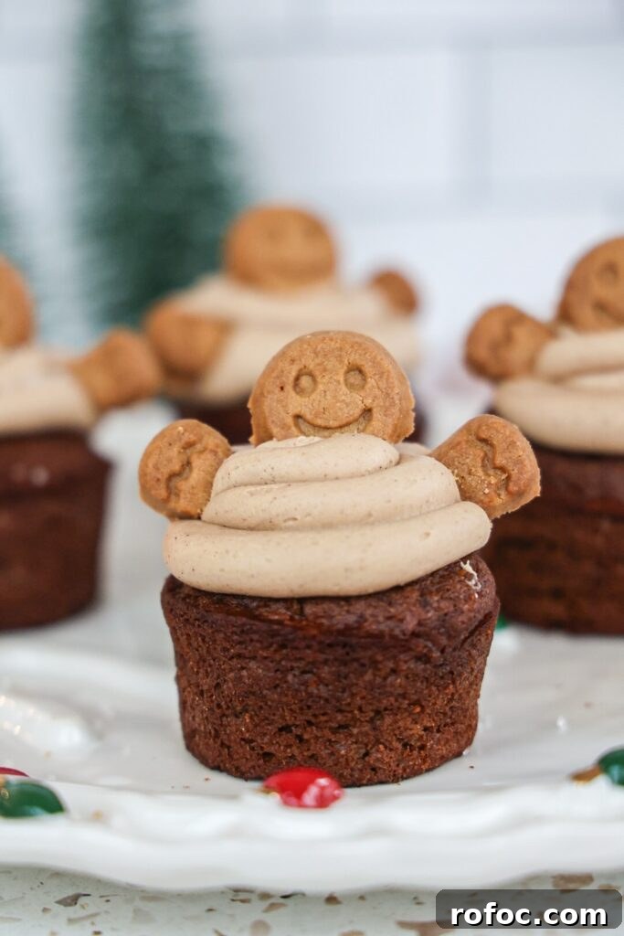 Pumpkin Cupcakes with Gingerbread Cream Cheese Frosting Recipe 2 Pumpkin cupcakes with gingerbread cream cheese frosting and gingerbread men cookies.