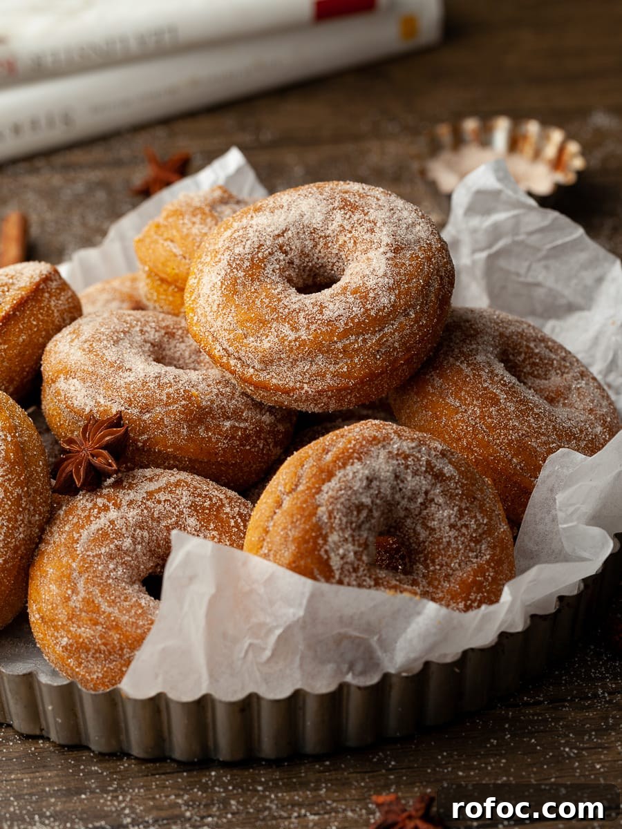 Delicious Gluten-Free Pumpkin Recipes for Fall Baking and Meals 2 A stack of healthy gluten free baked pumpkin donuts