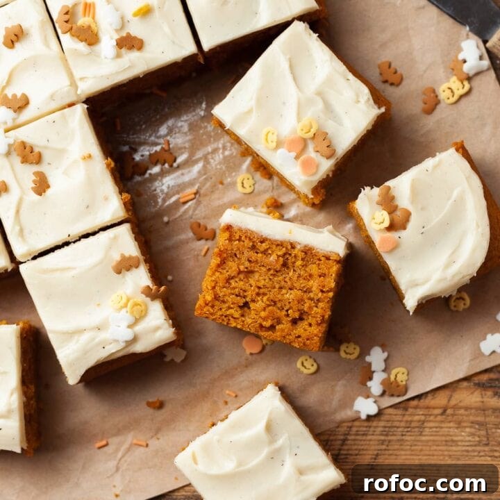 Enjoy soft, tender Gluten Free Pumpkin Bars packed with warm spices and rich pumpkin flavor, topped with maple cream cheese frosting