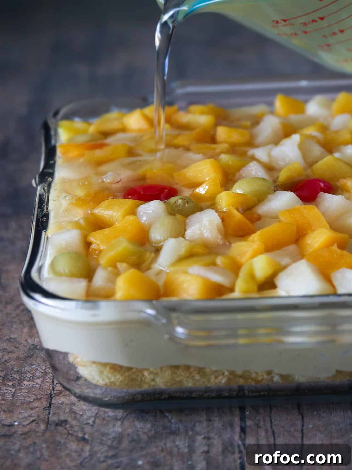 Creamy Fruit Custard Dessert Recipe 7 assembling crema de fruta in a glass dish