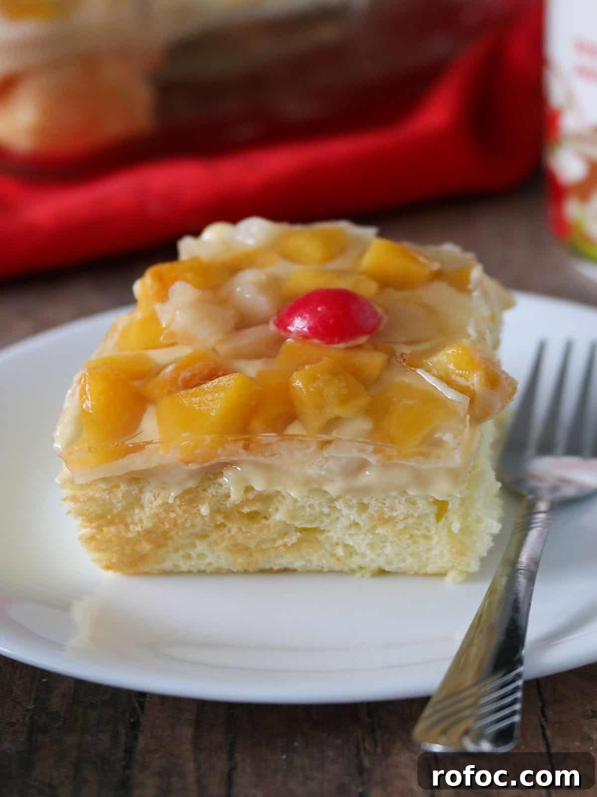 Creamy Fruit Custard Dessert Recipe 8 slice of crema de fruta on a white serving plate