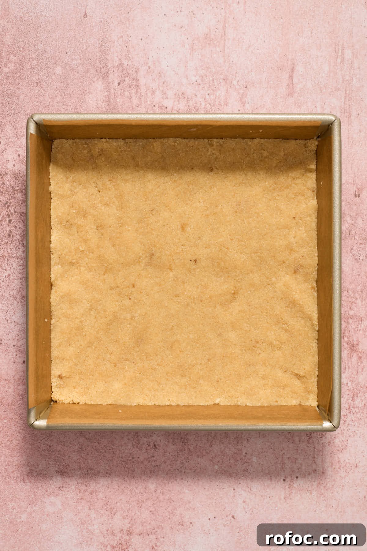 Almond Flour Cherry Pie Bars Recipe — Tender Cherry Dessert Bars 5 Crust mixture pressed into the bottom of a square pan.