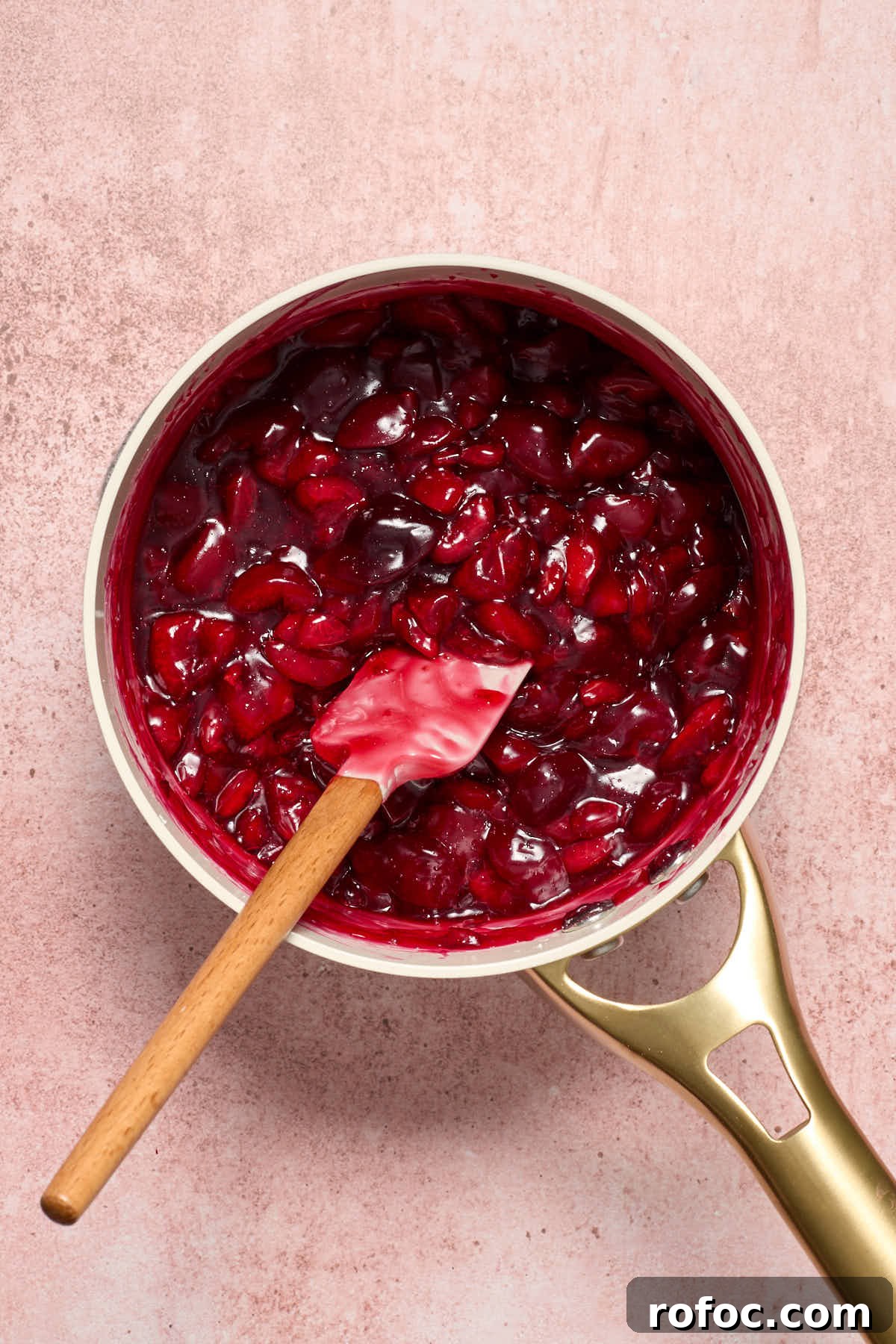 Almond Flour Cherry Pie Bars Recipe — Tender Cherry Dessert Bars 8 Cooked cherry pie filling in the saucepan with a spatula.