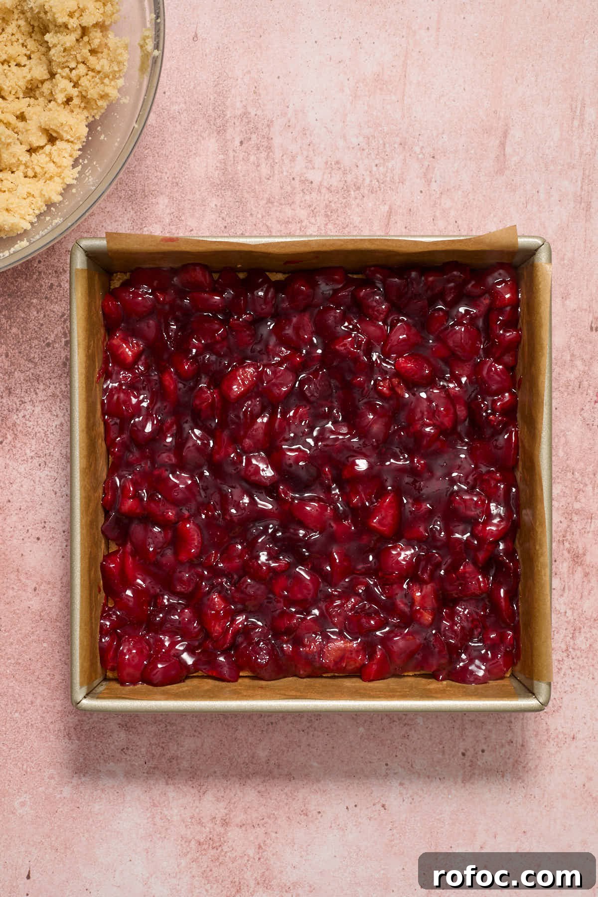 Almond Flour Cherry Pie Bars Recipe — Tender Cherry Dessert Bars 9 Cherry filling spread out on crust.