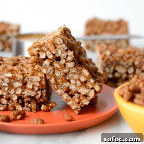 Peanut butter granola bars on an orange plate.