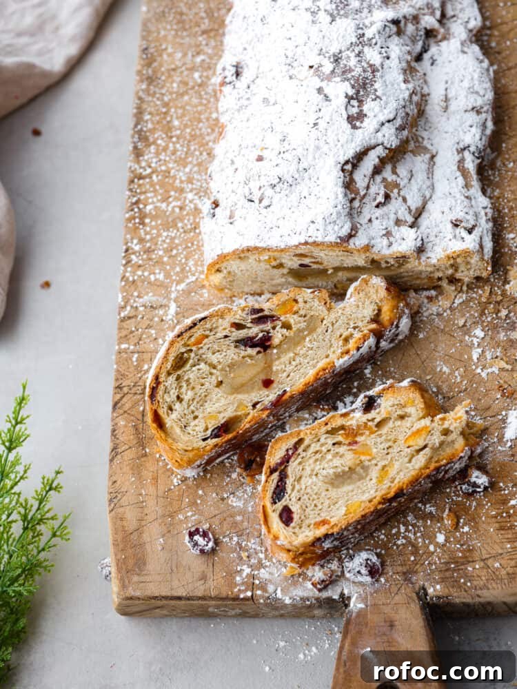 Sliced stollen showing almond filling. Top-down view of stollen, sliced into 2 pieces.