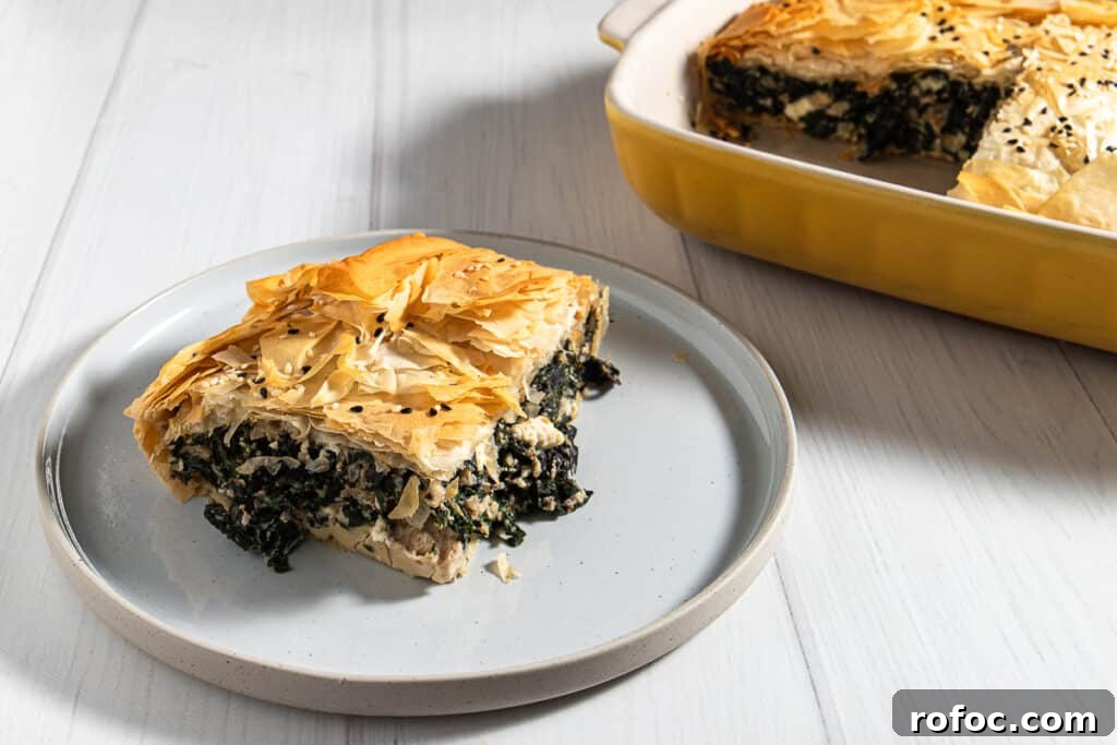 Swiss Chard & Mushroom Pie Recipe: Savory Vegetarian Tart 2 silverbeet and mushroom pie on a plate with the rest of the pie in the background