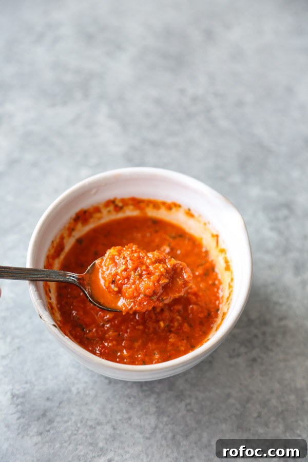 Portuguese Piri-Piri Chicken Thighs with Roasted Potatoes 4 peri peri sauce in a bowl