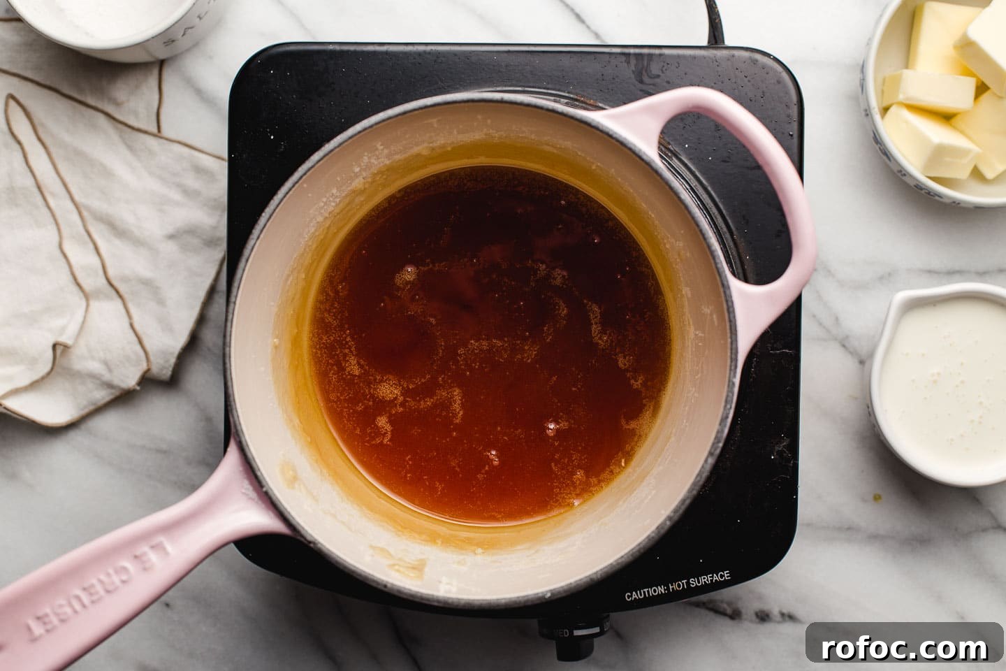 How to Make Homemade Salted Caramel Sauce at Home 4 Sugar browning in a saucepan.