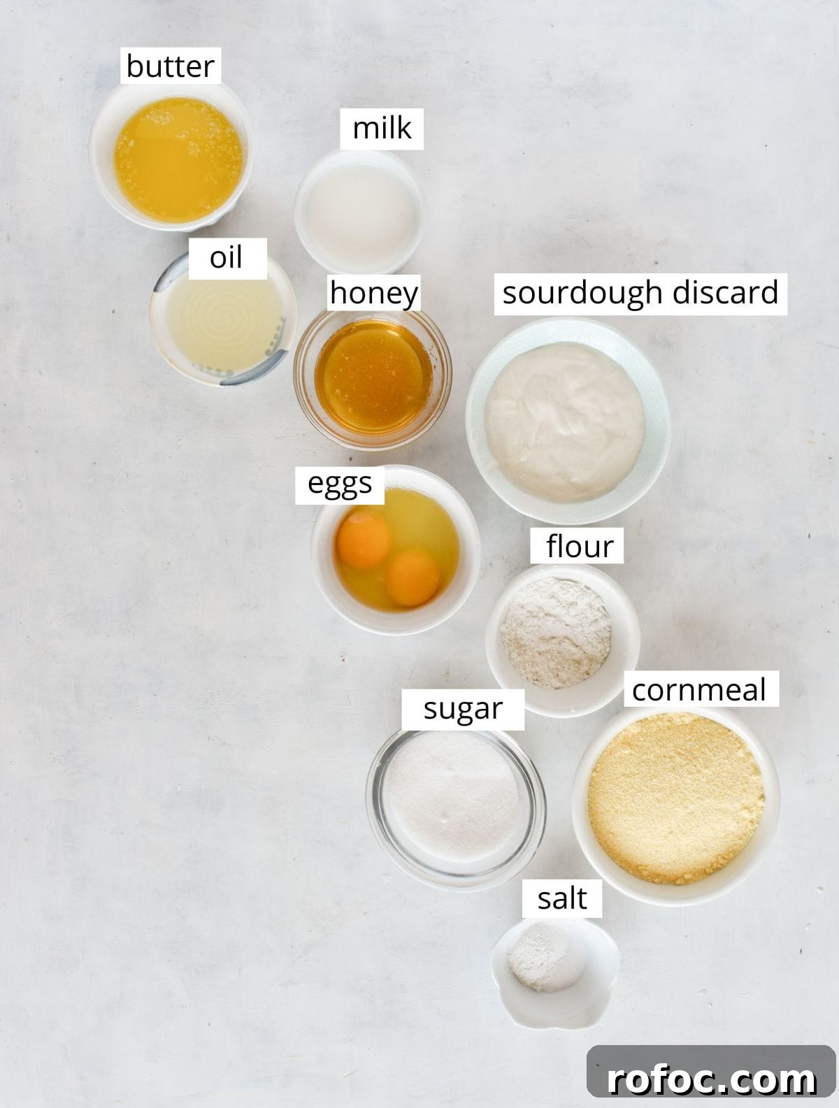 Sourdough Discard Cornbread Recipe: Tangy, Tender & Crispy 4 ingredients for recipe laid out and labeled.