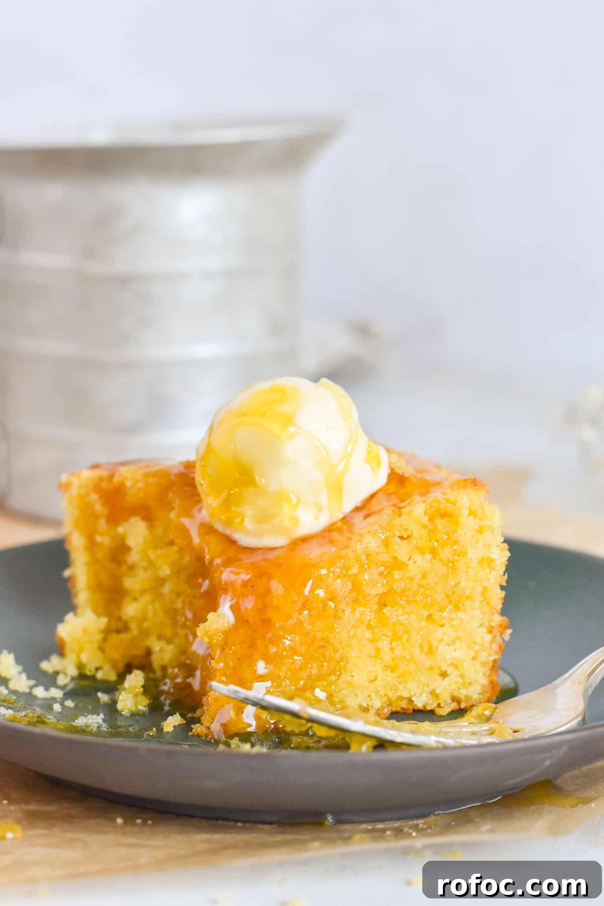 Sourdough Discard Cornbread Recipe: Tangy, Tender & Crispy 7 cornbread on plate with bite out of it.