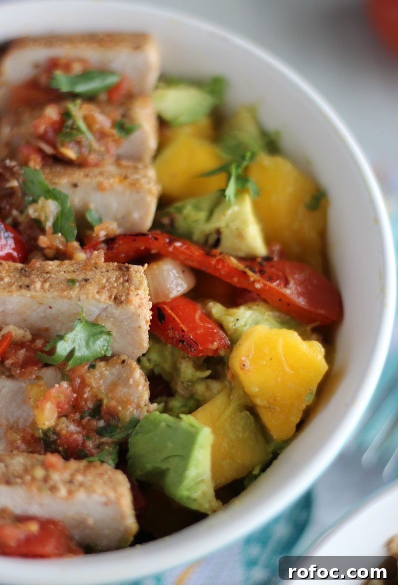 Grilled Pork Burrito Bowls with Cilantro Lime Rice and Salsa 11 Grilled Pork Burrito Bowls - loaded cauliflower rice bowls are packed with tender pork, sweet mango guac, fresh salsa, and grilled veggies! Oh my YUM. | fedandfulfilled.com